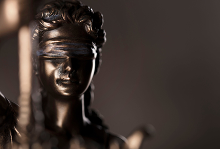 Close up of a bronze Statue of Justice.